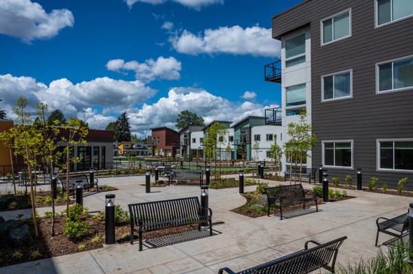 Outdoor courtyard with benches and landscaping