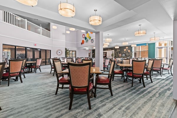 Bright dining area with tables and chairs