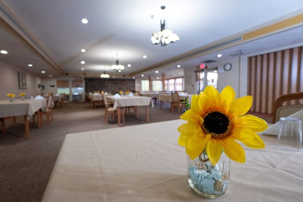 Dining room with tables set up for residents