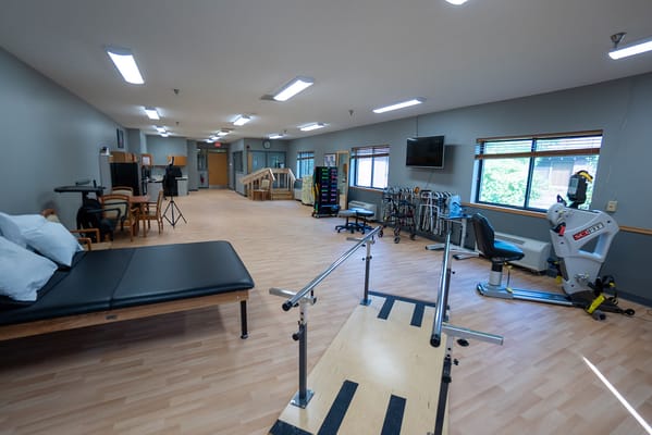 Empty rehabilitation space with therapy equipment