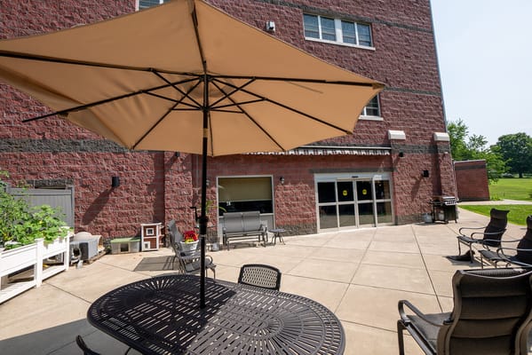 Outdoor patio area with seating and umbrellas