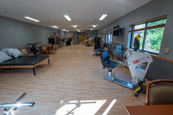 Therapy and activity room with exercise equipment