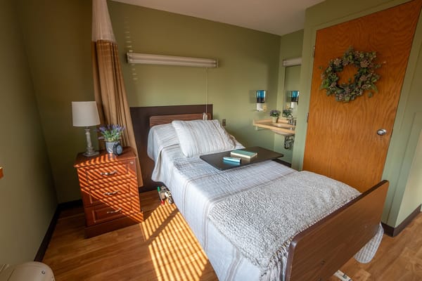 Cozy resident room with bed and decorative elements