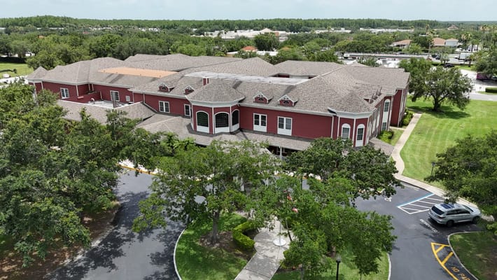 Aerial view of Spring Hills Hunters Creek senior living facility showcasing the building and surrounding landscape.