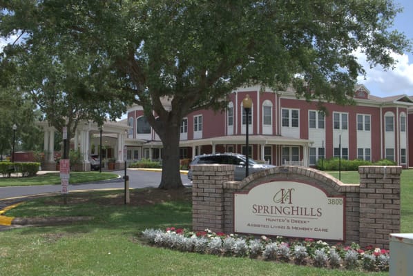 Entrance sign and building of Spring Hills Hunters Creek Senior Living Facility