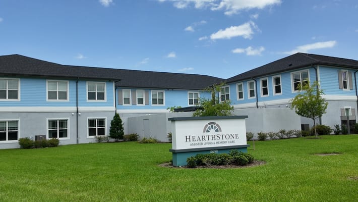 Exterior view of HearthStone at Nona Lakes building and sign