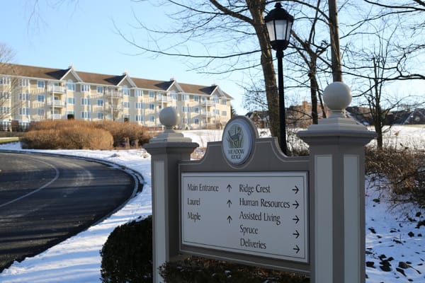 Exterior signpost with directions at Meadow Ridge