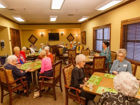 Residents playing bingo in a common area