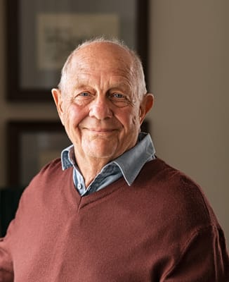Smiling elderly man in a sweater