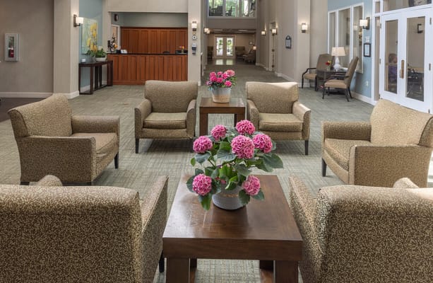 Interior seating area with flowers and chairs