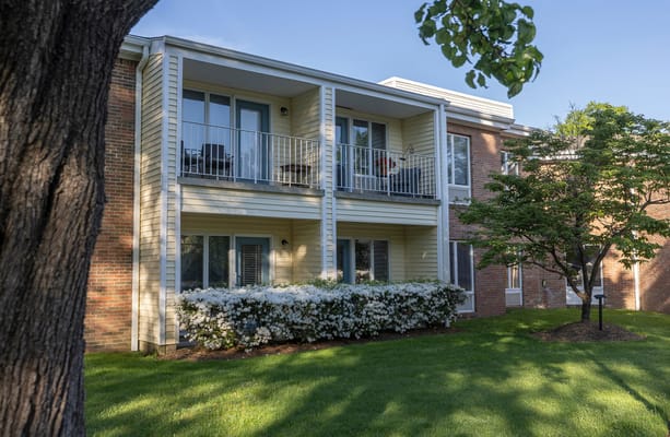 Building exterior with landscaped area and balconies