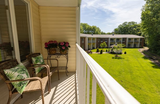 View from a balcony overlooking landscaped grounds