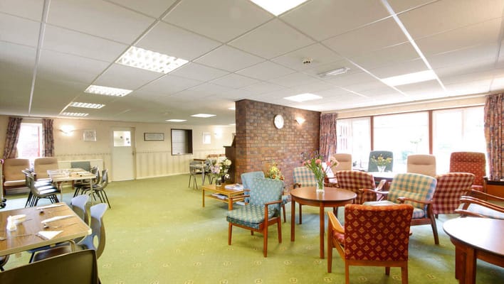 Bright common area with seating and tables