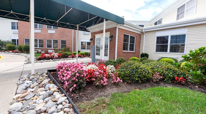Entrance with a flower garden and canopy