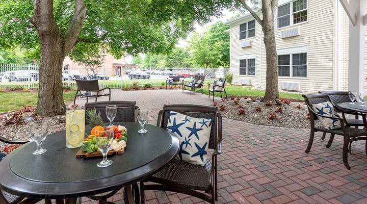 Outdoor dining area with tables and food spread