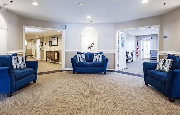 Bright common area with blue seating and decor