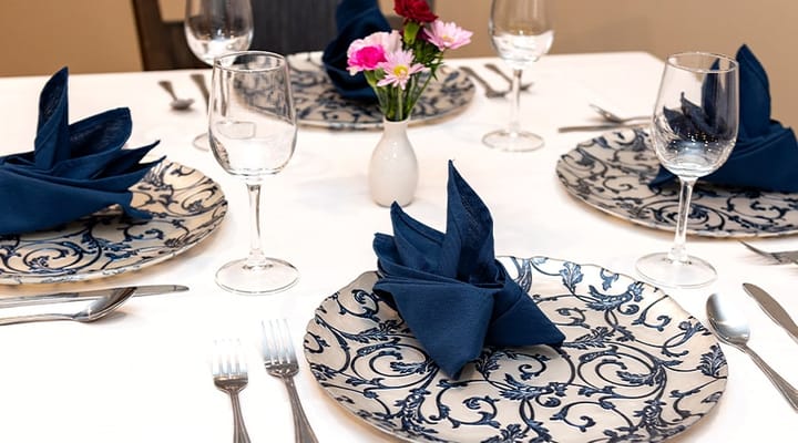 Elegant dining setup with floral centerpiece and table settings