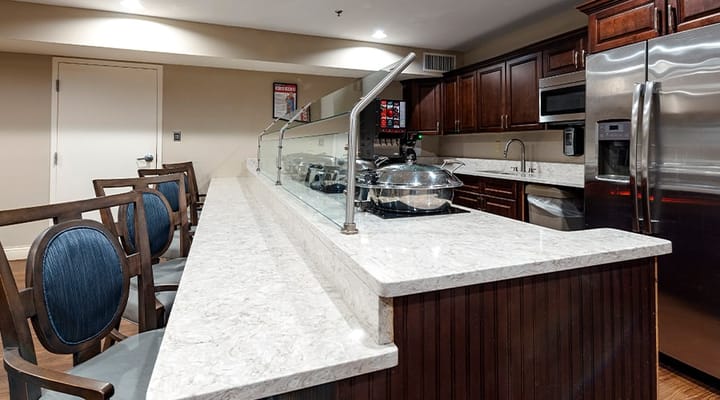 Interior view of a dining area with kitchen features