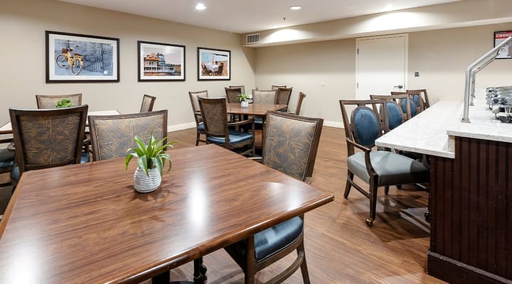 Dining area with wooden tables and chairs