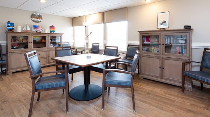 Common area with comfortable seating and bookshelves