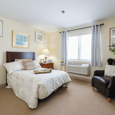 Bright and cozy resident bedroom with a view