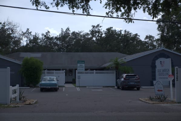 Main entrance of Great American Assisted Living with welcome sign.
