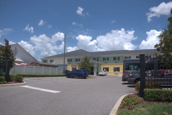 View of the entrance and parking area at Senior Point Assisted Living.