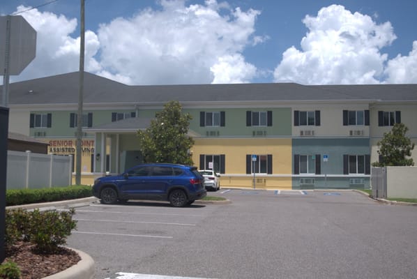 Front view of Senior Point Assisted Living facility with colorful exterior.