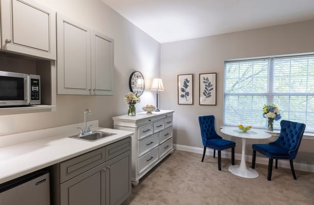 Cozy interior of a resident's room with kitchenette