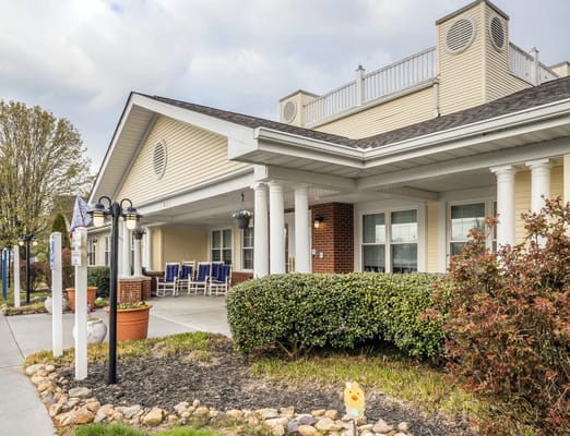 Exterior view of the assisted living facility with a front porch