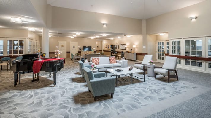 Spacious common area with seating and piano