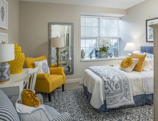Brightly decorated resident room with floral accents