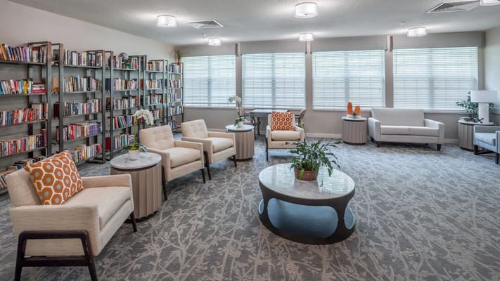 Interior common area with seating and bookshelves