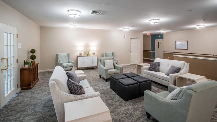 Bright common area with seating and natural light