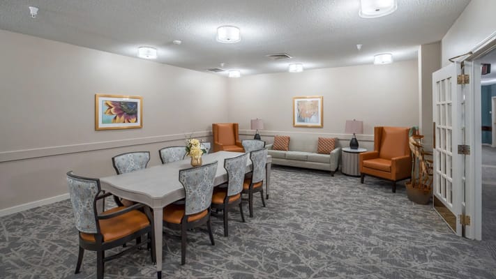 Bright common area with seating and dining table