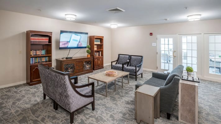 A common area with seating and a television