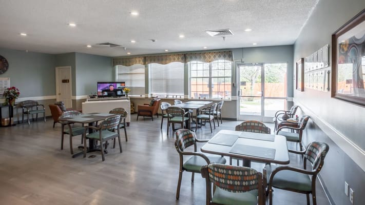 Bright dining area with tables and chairs