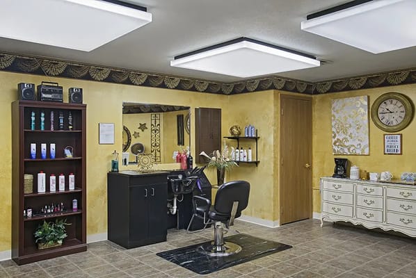 Hair salon interior with styling chair and products