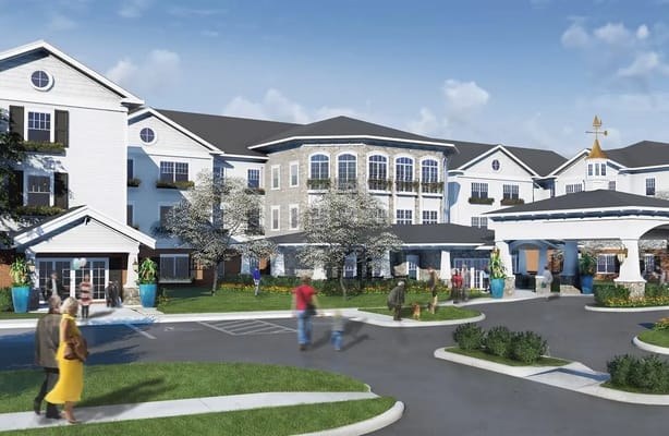Exterior view of the facility with residents and landscaping