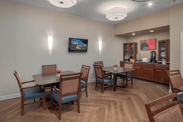 Bright and inviting common area with tables and chairs