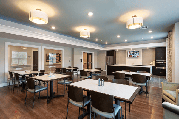 Interior view of a dining area with tables and chairs
