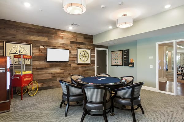 Interior of a game room with poker table.
