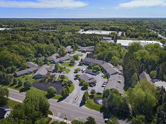 Aerial view of an assisted living community surrounded by greenery