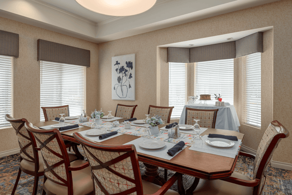 Elegant dining room setup with a large table and window light