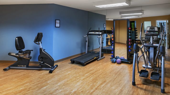 Well-equipped fitness room with exercise machines