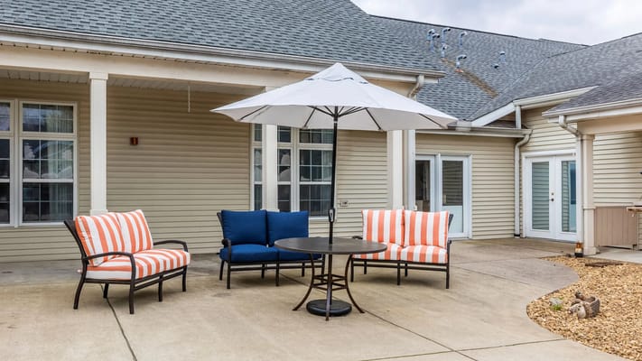 Outdoor seating area with table and umbrella