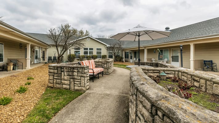 Outdoor courtyard with seating and an umbrella