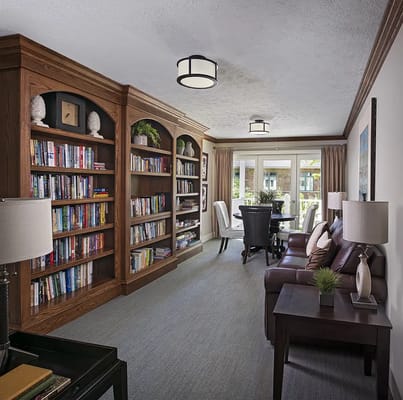 Cozy common area with bookshelves and seating