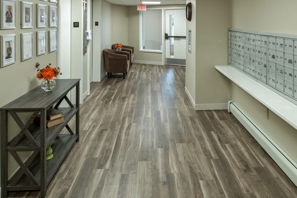 Interior hallway with seating and mailboxes