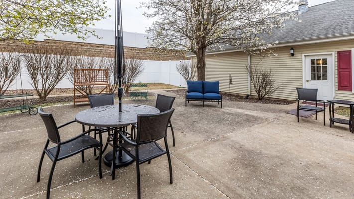 Outdoor seating area with tables and chairs